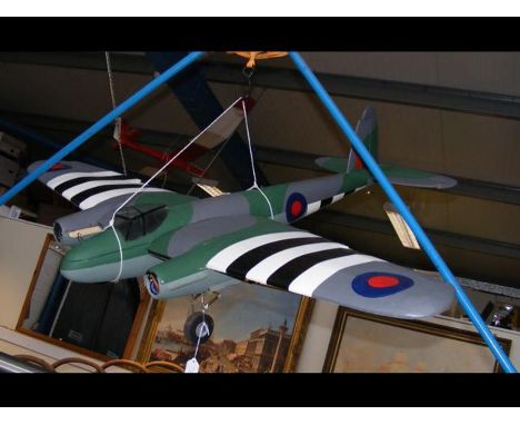 A model twin engine airplane resembling a Mosquito bomber - unfinishedCONDITION REPORTThere are no propellers included.