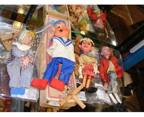 A boxed Barnsbury sting puppet of Popeye, together with three other puppets including Pelham Puppets Pinocchio and Prince Cha