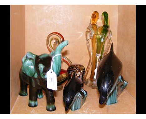 A Poole Pottery Dolphin figure, in the company of other collectable ceramic and glassware 