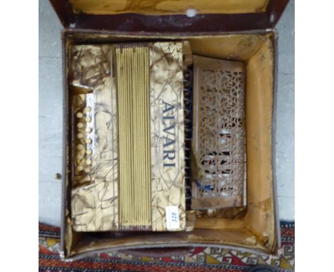 An Alvari piano accordion, in a mother-of-pearl effect case       CS
