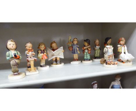 Ten Goebel/Hummel china figures: to include a boy reading a newspaper  4.5''h; and another walking with an umbrella and a pup