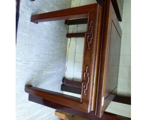 A mid 20thC Chinese rosewood lamp table, the top with a mitred edge, over a carved frieze, raised on square, chamfered legs  