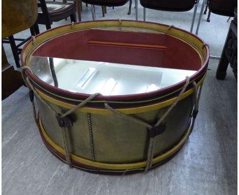A Timothy Oulton military drum design wall mounted display cabinet with glazed mirror panels & LED lighting  16''h  32''dia  