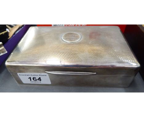 A silver cigarette case with straight sides, on an engine turned hinged lid and cedar lined interior  Birmingham 1929  6''w  