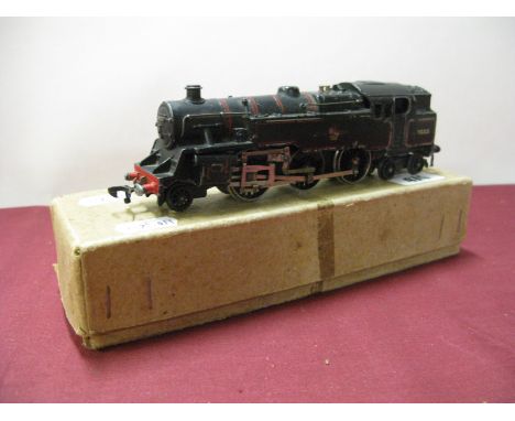 A Hornby Dublo Two Rail 2-6-4 Standard Tank R/No.80033, in a repair box.