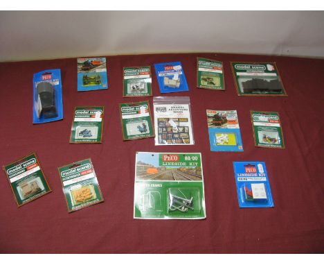 A Quantity of OO/HO Scale Plastic Model Figures, Animals, Packing Cases, Signs, Gas Lamp Posts, all in original packaging.