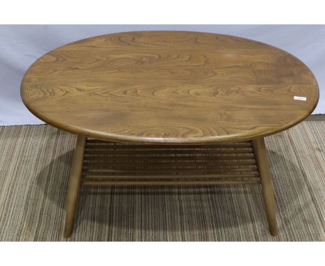 Ercol elm oval coffee table with stick under tier, 100 x 85 x 45 cm H. Not available for in-house P&amp;P 