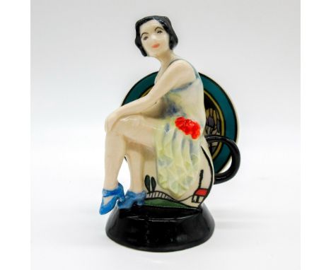 Figurine of the ceramist Clarice Cliff seated on an Art Deco teapot.'Renaissance', Collector's Guild series. Kevin Francis ba