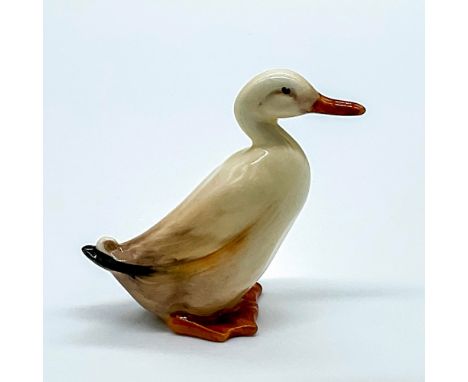 Cream-white with black tip at the tail feathers and khaki feet and beak. Doulton England backstamp. Model no. 395. Issued: 19