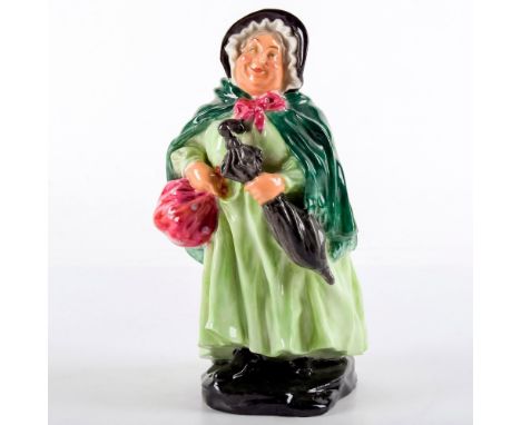 Style Three. She wears a light green dress, dark green shawl, and carries a bag and umbrella.Royal Doulton backstamp. From th