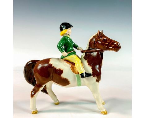A glossy figure of a young girl in green and yellow riding a spotted brown and white horse; model no. 1499. Beswick backstamp