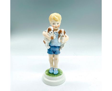 Porcelain figure of a young boy with carrying two puppies. Royal Worcester backstamp. Dimensions: 2.5"L x 2.5"W x 7.5"HManufa