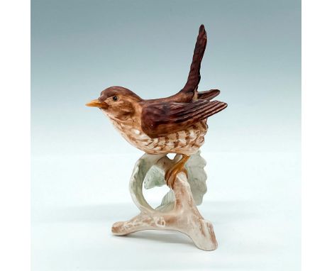 Figurine of a brown bird perched on a pale green branch. W.Goebel sticker and backstamp. Issued: c. 1969Dimensions: 3.5"L x 3