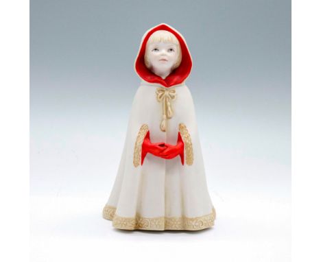 Figure of the popular storybook character wearing an ivory cloak trimmed with floral detail, red lining and red gloves. Cybis