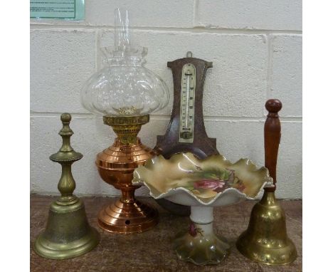 Two brass bells, a comport, a barometer and an oil lamp