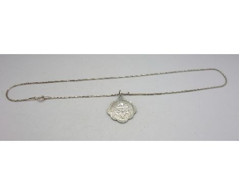 A silver pendant and chain, the pendant stamped 950