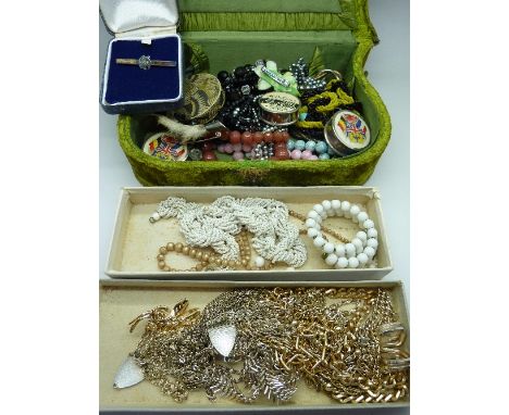 Costume jewellery including two necklace and earring sets, an enamel butterfly buckle, three tape measures, etc.