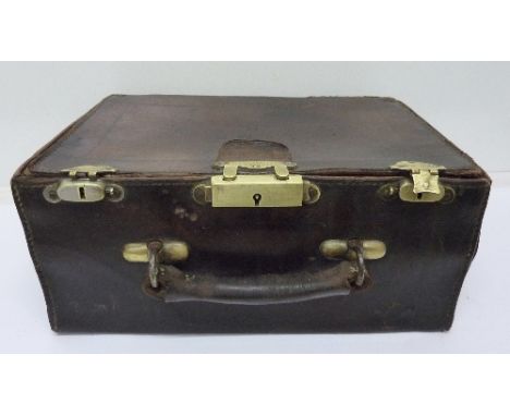 A Victorian brown leather case, The Exchange, Thos Keane & Son Ltd., Worcester St., Birmingham, with brass lock