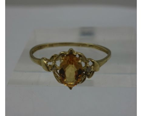 A 9ct gold, diamond and citrine ring, weight 0.9g, size O