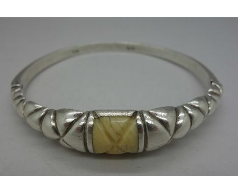 A silver and ivory bangle, weight 24.3g