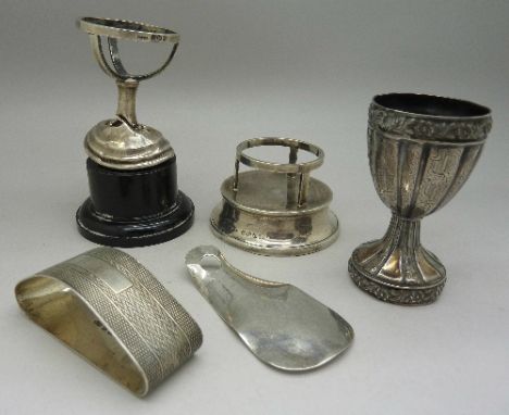 Five items of silver including a napkin ring, egg cup, etc., weight 139g