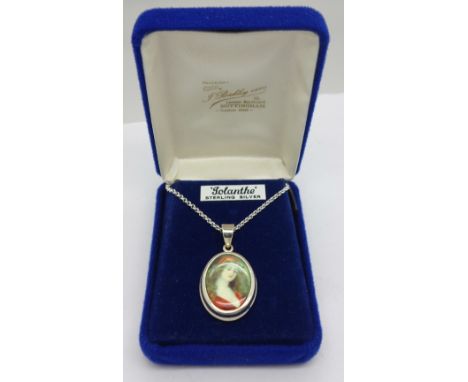 A silver portrait pendant and chain