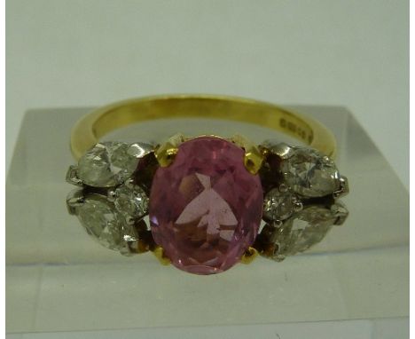 An 18ct yellow and white gold pink tourmaline and diamond ring, pink tourmaline approximate weight 1.87 carat, with Marquis a