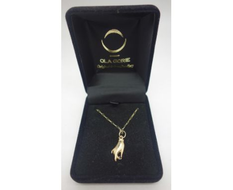 A 9ct gold hand shaped pendant set with a blue stone on a 9ct gold chain, weight 1.6g