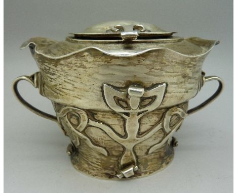 An Arts and Crafts silver tea caddy, C.H. maker, Birmingham 1902, weight 268g