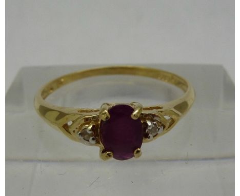 A 9ct gold, diamond and garnet ring, weight 1.1g, size N