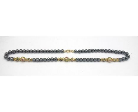 A hematite and enamel bead necklace with 14ct gold plated clasp