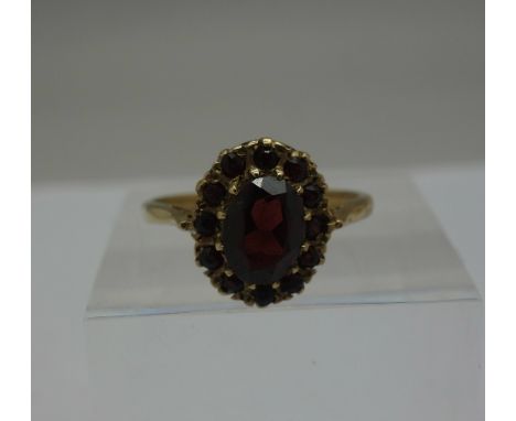 A 9ct gold and garnet cluster ring, weight 2.8g, size R