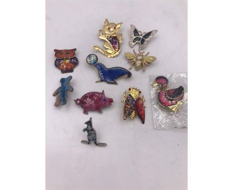Ten enamel/cloisonné animal brooches to include owls and a bug 
