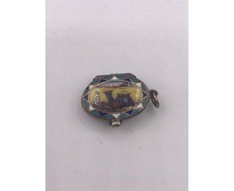 An Egyptian enamel Moses basket in miniature.