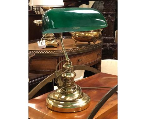 A green glass desk, reading lamp.