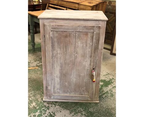 A three shelf cupboard with additional draw 