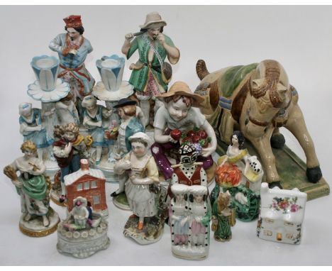 A collection of mostly ceramic figures to include:- a large horse, a pair of hand painted candlesticks featuring a young girl