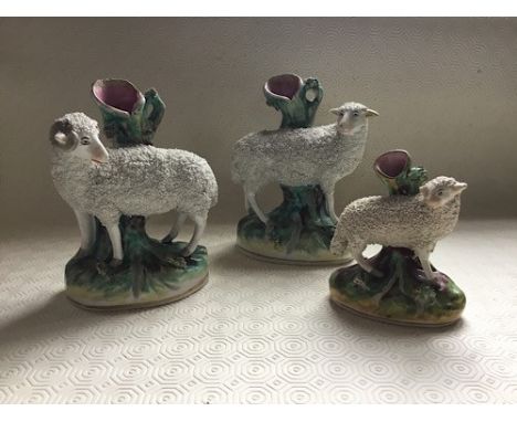 Three late 19th century Staffordshire flat back figures of Ram, Ewe and lamb, the ram model standing at 19cms , some restorat