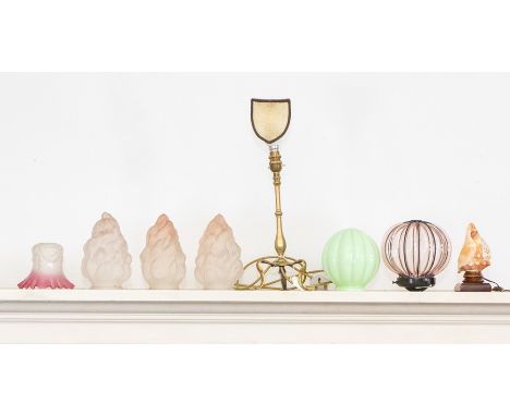 A brass Pullman table lamp with three scroll legs, another with carved cameo shade, three glass "flame" shades, an Art Deco g