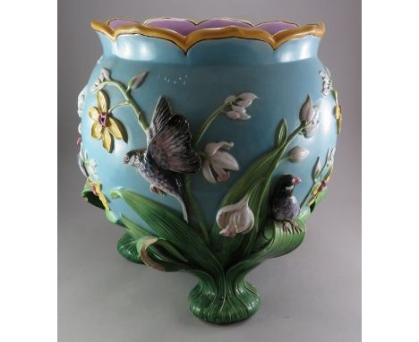 George Jones Majolica Jardiniere, circa 1876, of globular form with a lappit-shaped rim, supported on three feet formed from 