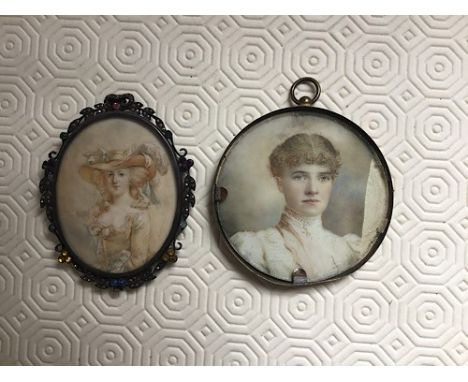 A miniature portrait of a young lady in late Victorian dress, watercolour on ivory, circa 1900, diameter 7.5cms [piece missin