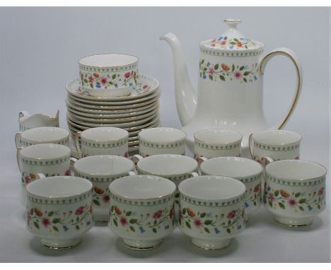 A tea and coffee set by Paragon China, the Anastasia pattern floral with gilding comprising:- six coffee cups, 7 tea cups (on