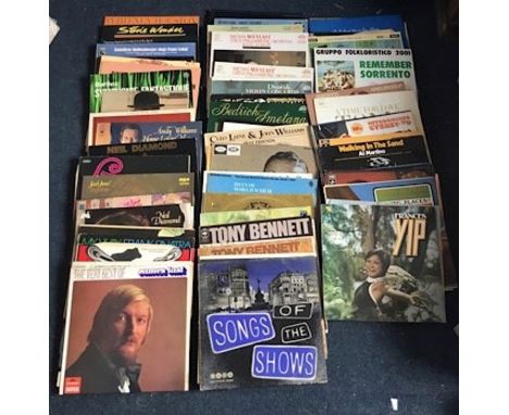 A box of Lp’s and singles including Classical and Hits from 1950’s Nat King Cole to 1980’s Neil Diamond also The very best of