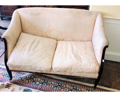 An Edwardian mahogany salon two seater sofa, circa 1910, scrolling arms, raised on tapered supports on brass castors. 86cm H 