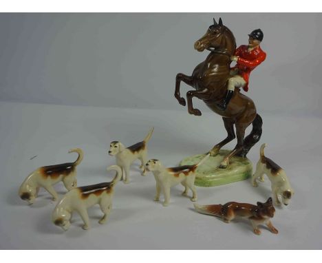 Beswick Porcelain Hunting Group, Comprising of a Huntsman on Horseback, With five Hounds and Fox, Horse and Rider 24.5cm high