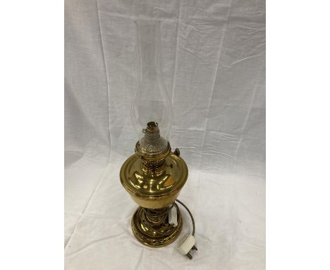 A BRASS OIL LAMP CONVERTED TO ELECTRIC 