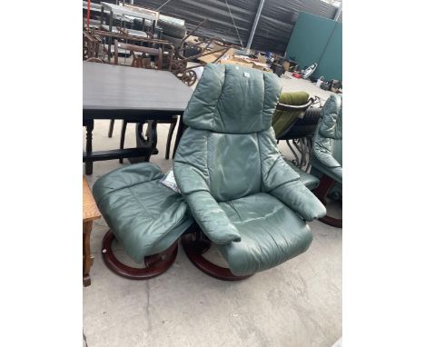 A GREEN STRESSLESS SWIVEL RECLINER AND STOOL 