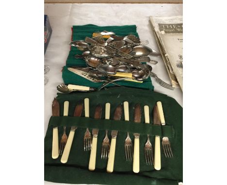 A LARGE QUANTITY OF VINTAGE FLATWARE INCLUDING KNIVES, FORKS, SPOONS, SERVING UTENSILS, ETC 