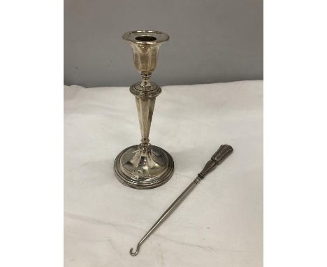 A HALLMARKED SHEFFIELD SILVER CANDLESTICK AND A BIRMINGHAM BUTTON HOOK 