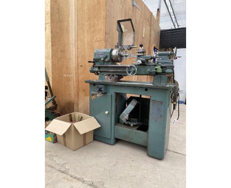 A BOXFORD TURNING LATHE WITH A BROOK CROMPTON MOTOR, VARIOUS COGS, ATTATCHMENTS AND TOOLS ETC 